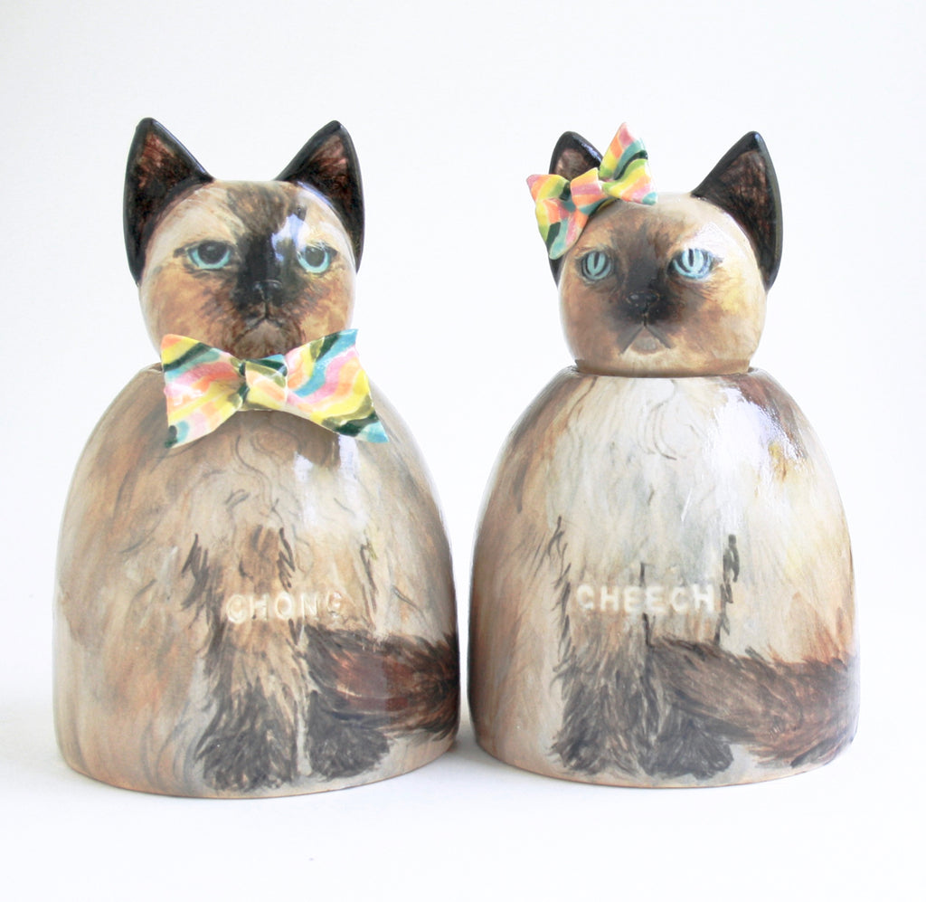 Urns for cats that can be customized or purchased as seen in listings. 