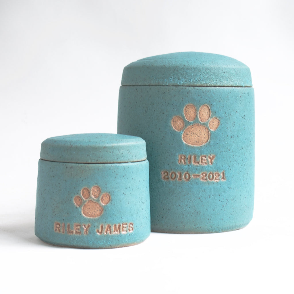 Urns for dogs in a variety of shapes and sizes.